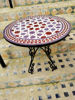Colorful handmade Moroccan coffee table featuring a vibrant purple and pink circular mosaic design, perfect for indoor or outdoor use.