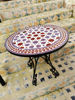 Colorful handmade Moroccan coffee table featuring a vibrant purple and pink circular mosaic design, perfect for indoor or outdoor use.