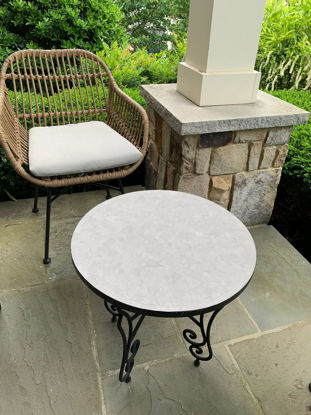 Round marble-top coffee table, showcasing intricate Moroccan Zellige tilework in a modern design.