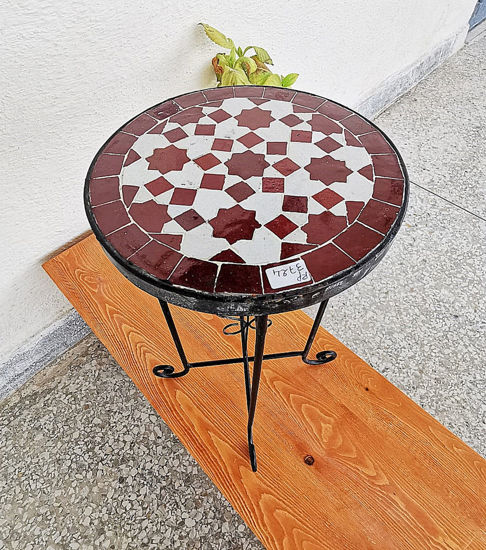 Handcrafted Moroccan mosaic table featuring vibrant colors and intricate patterns, suitable for indoor and outdoor use.