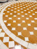 Close-up of a Handmade round mosaic coffee table in gold and white, perfect for enhancing any living space.