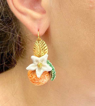 Picture of Orange earrings with white flower and leaf