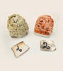 Two rocks, part of a handmade Peruvian stone nativity scene ornament for Christmas decor.