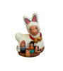 Handmade terracotta figurine: a llama and a rabbit, part of a Peruvian nativity scene ornament celebrating Christmas.