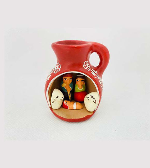Handmade terracotta vase featuring a Holy Family figurine, showcasing Peruvian artisan craftsmanship and festive holiday decor.