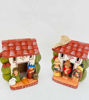 Vintage Peruvian nativity scene set featuring two ceramic figurines: a house with a man and woman, showcasing folk art craftsmanship.
