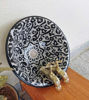 Black and white ceramic basin sink with gold faucets, showcasing Moroccan craftsmanship and unique artistry.