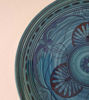 Handcrafted 14-inch Moroccan ceramic plate in blue, adorned with intricate patterns, perfect for serving or as wall decor.