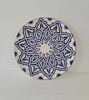 A 14-inch handmade Moroccan ceramic plate in blue and white, featuring intricate hand-painted designs and a glossy finish.