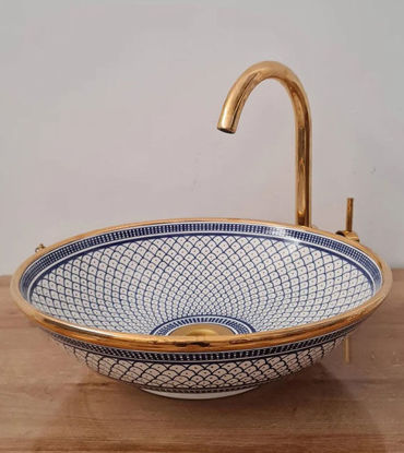 Elegant Fez blue ceramic sink with a 14K gold rim, highlighting Moroccan craftsmanship, ideal for luxury bathrooms.