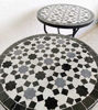 Two elegant Moroccan marble side tables with striking black and white Zellige tile designs, ideal for indoor or outdoor use.