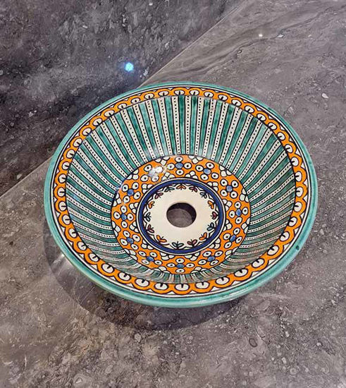 Colorful hand-painted Moroccan ceramic vessel sink with elegant design, perfect for modern or traditional bathroom decor.