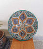 Colorful Moroccan ceramic bowl on a table, featuring unique hand-painted designs that highlight traditional craftsmanship.