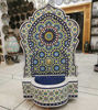 Colorful Moroccan mosaic fountain with floral patterns, showcasing vibrant artistry and calming water flow in a store setting.