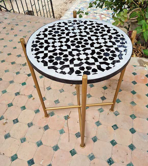 Black and white mosaic coffee table with a golden base, showcasing intricate geometric patterns, handcrafted in Morocco.