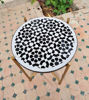 Round black and white mosaic table, featuring traditional Moroccan designs, perfect for indoor or outdoor use.