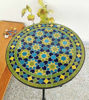 Colorful round mosaic table featuring a green and blue design, showcasing intricate Moroccan craftsmanship and vibrant artistry.