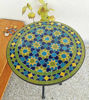 Handmade Moroccan mosaic table with a green and blue pattern, perfect for adding charm to indoor or outdoor spaces.