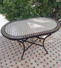 Customizable oval Moroccan mosaic table featuring vibrant Zellige tile art, perfect for indoor or outdoor use.
