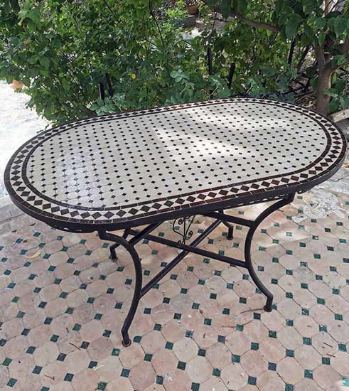 Customizable oval Moroccan mosaic table featuring vibrant Zellige tile art, perfect for indoor or outdoor use.