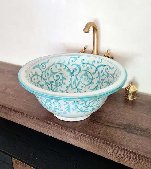 Ceramic sink with a vibrant blue and white fish scales pattern, handcrafted to bring coastal elegance to your bathroom.