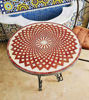 Handmade Moroccan bistro table featuring a round shape and detailed red mosaic pattern, perfect for indoor or outdoor use.