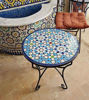 Round coffee table featuring a colorful mosaic tile design in blue, reflecting authentic Moroccan craftsmanship and artistry.