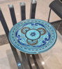 Handmade Moroccan ceramic plate set featuring a blue and white decorative design, showcasing artisan craftsmanship and elegance.