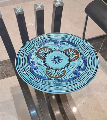 Handmade Moroccan ceramic plate set featuring a blue and white decorative design, showcasing artisan craftsmanship and elegance.