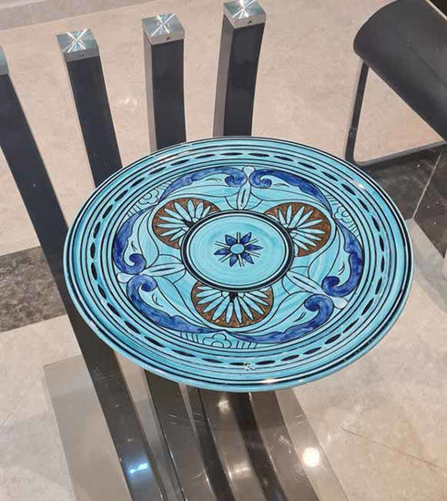 Handmade Moroccan ceramic plate set featuring a blue and white decorative design, showcasing artisan craftsmanship and elegance.