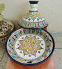 Colorful handmade Berber tagine and bowl with intricate designs, showcasing Moroccan ceramic artistry and vibrant glazes.