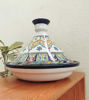 A vibrant, intricately designed Berber tagine and bowl, highlighting the craftsmanship of Moroccan ceramic cooking ware.