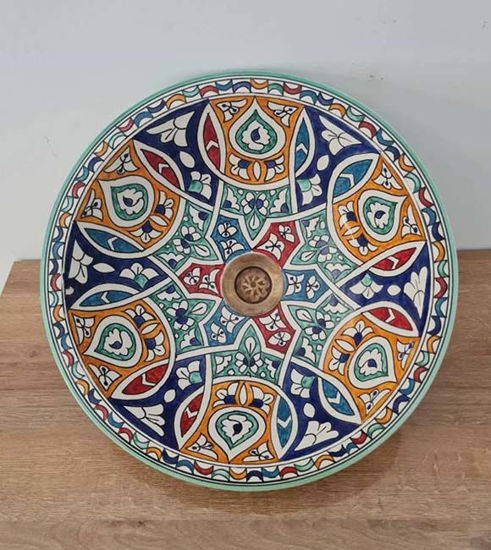Colorful handmade Moroccan ceramic sink with intricate patterns, showcasing mid-century modern design.
