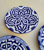 Decorative blue and white ceramic plates featuring unique patterns, ideal for enhancing home decor or serving food.
