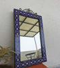 Intricate blue and white designs adorn this handmade Moroccan mosaic mirror, perfect for enhancing any living space.
