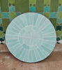 Vibrant turquoise tile table with a circular mosaic design, perfect for indoor or outdoor decor, reflecting Moroccan artistry.
