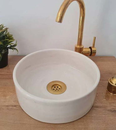 Off White Countertop Basin handcrafted in Morocco perched on a wooden counter