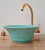 Vibrant turquoise bowl sink with a solid brass faucet, highlighting traditional Moroccan craftsmanship and mid-century modern style.