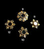 Four decorative gold sun-shaped mirrors set on a black background, emphasizing their unique designs and artisanal quality.
