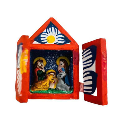 A small wooden nativity scene featuring the Holy Family and three children, handcrafted in vibrant Peruvian folk art style.