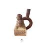 Handcrafted ceramic figurine of a man and woman sitting on a wooden box, representing Moche Pre-Columbian erotic art.
