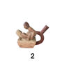 Figurine depicting a man and woman on a wooden box, handcrafted in the Moche style, reflecting ancient Peruvian erotic art.