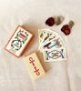 A tarot card deck featuring a rose and a box of cards, symbolizing divination and interpretation of life events.