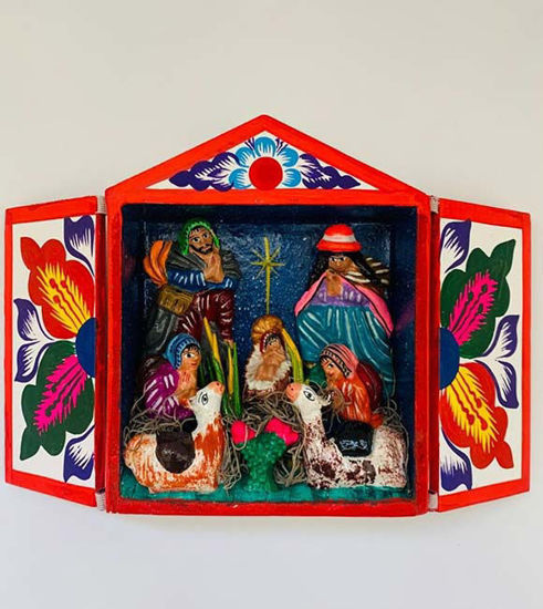 Handmade Peruvian retablo featuring a colorful Nativity scene of the Holy Family, crafted from wood and natural paints.