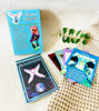 The "Message from Your Angels" oracle card deck, showcasing 44 angelic illustrations and a Spanish guidebook for personal readings.