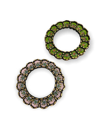 Two mirrors: one green with gold accents, one pink with gold accents, displayed against a neutral background.