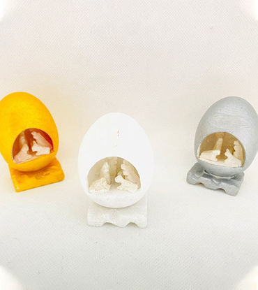 Show details for Small White Stone Nativity Scene | Handcarved 3” Figurine | Peruvian Christmas & Holiday Decor | Holy Family Sculpture Three small eggs with tiny figures inside, representing the Holy Family in a handcarved white stone nativity scene.