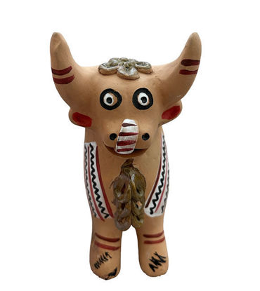 Handmade Peruvian clay bull figurine featuring tribal patterns, representing protection and prosperity in Andean culture.