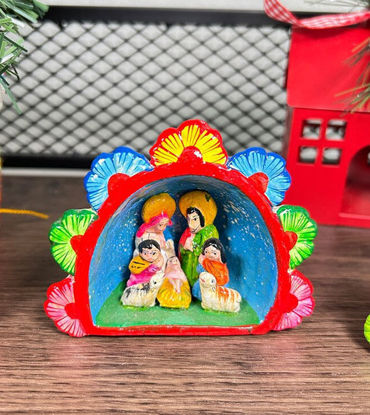 Small handmade Peruvian nativity scene figurine, showcasing traditional Andean craftsmanship in clay.