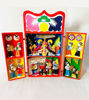 A box containing a vibrant handmade Peruvian nativity scene, featuring the Holy Family in a beautifully painted retablo.